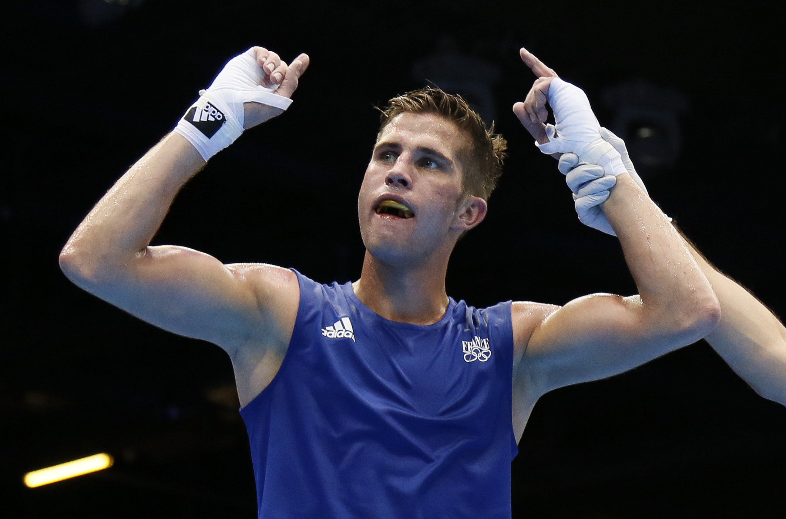 PHOTO: Alexis Vastine of France is declared winner over Tuvshinbat Byamba of Mongolia in their round of 16 Welterwight match of the London 2012 Olympic Games at the ExCel Arena on August 3, 2012 in London.