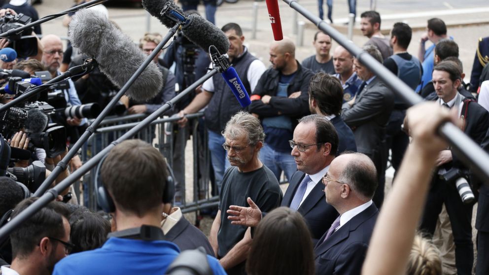 PHOTO: French President Francois Hollande speaks to the press as he leaves the Saint-Etienne-du-Rouvray's city hall following a hostage-taking at a church of the town on July 26, 2016 that left the priest dead. 