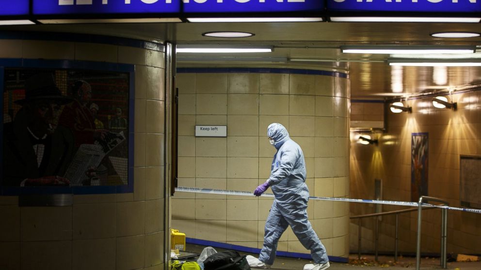 LONDON, UNITED KINGDOM - DECEMBER 05: Police officers and crime scene investigators investigate a crime scene at Leytonstone tube station in east London, England, on December 05, 2015 after a man was seriously injured in a knife attack and it is treated as a terror attack because the attacker reportedly shouted "This is for Syria" during the attack.