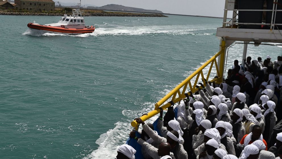 PHOTO: Migrants arrive in the port of Cagliari, Sardinia, aboard rescue ship "Aquarius", on May 26, 2016, two days after being rescued near the Libyan coasts.