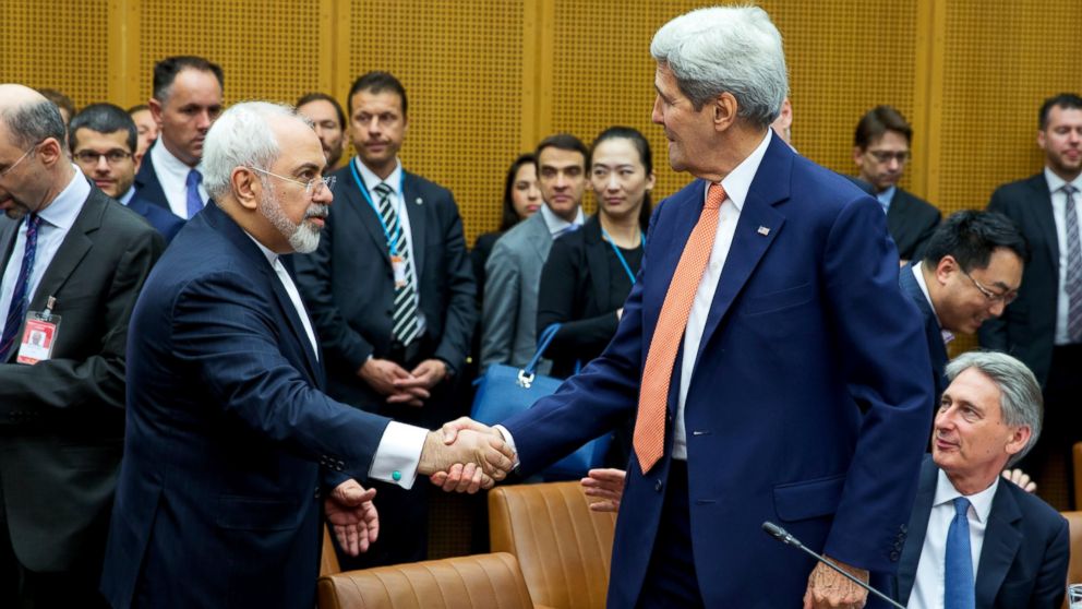 Foreign Minister of Iran, Mohammad Javad Zarif shakes hands with U.S. Secretary of State John Kerry,  July 14, 2015, in Vienna.