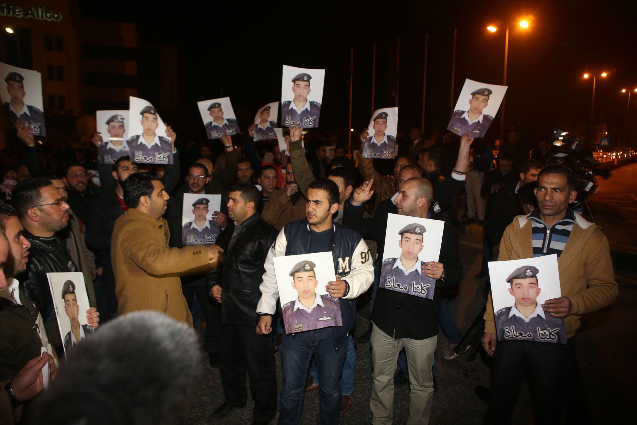 PHOTO: Protestors carry pictures of Mu'ath al-Kaseasbeh, Jordanian pilot who crashed in Syria, at a protest near the Jordanian Prime Minister office in Amman, Jordan, Jan. 27, 2015.