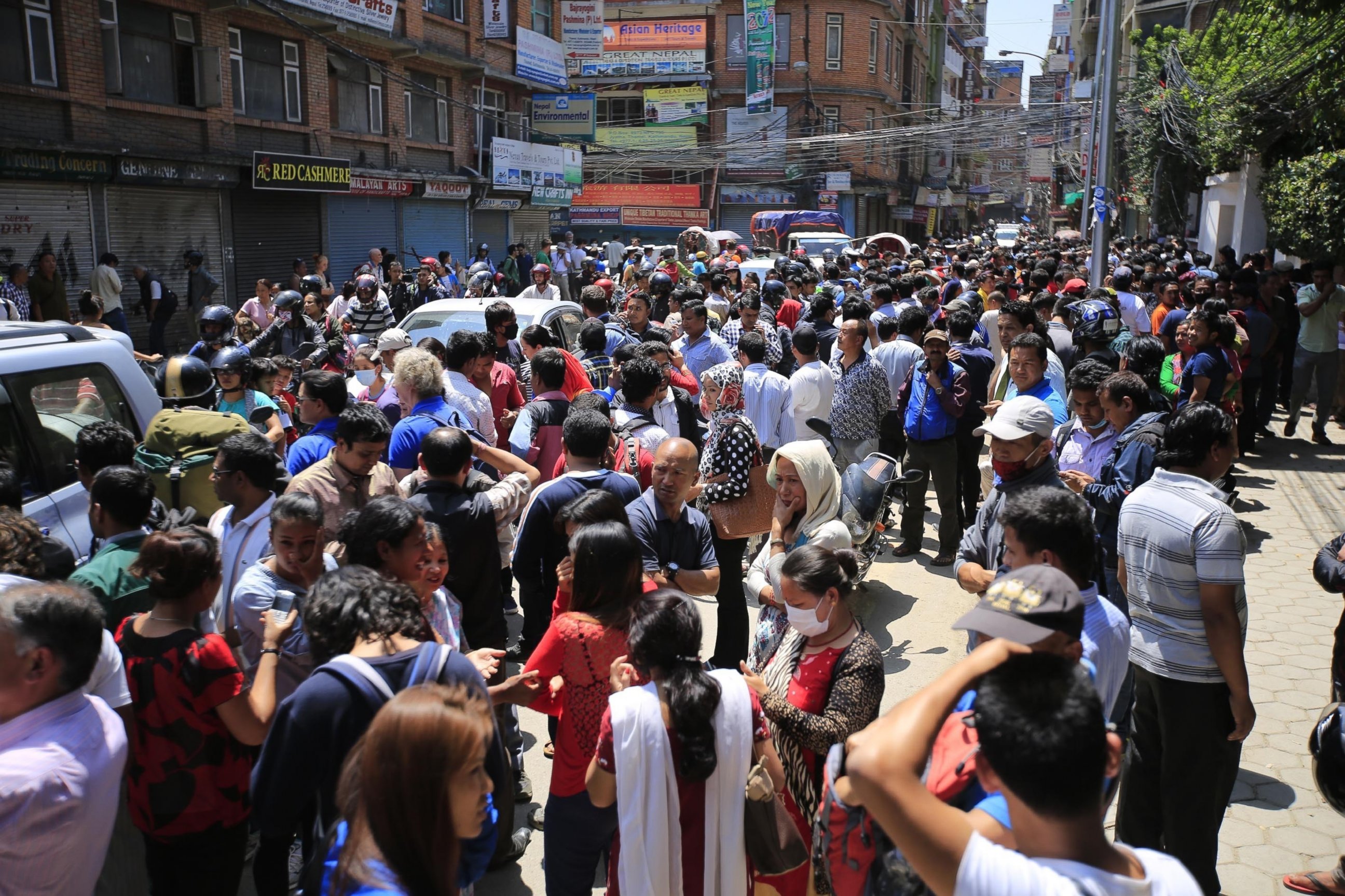 PHOTO: People run into the streets after a magnitude 7.3 earthquake hit Nepal as the country recovers from last month's devastating earthquake, in Kathmandu, Nepal, on May 12, 2015.