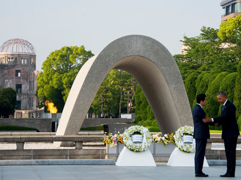 PHOTO: President Barack Obama and Japanese Prime Minister Shinzo Abe shake hands after laying wreaths at the Hiroshima Peace Memorial Park in Hiroshima on May 27, 2016.