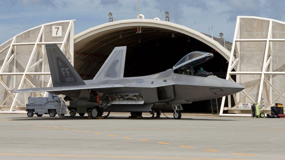 PHOTO:An F-22 Raptor from Langley Air Force Base, Virginia, sits in front of a hardened aircraft shelter at Kadena Air Base, Okinawa in this undated file photo. 