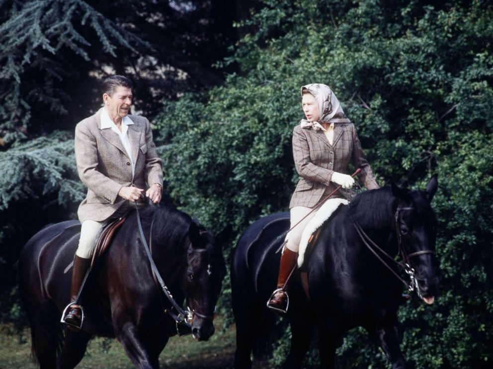 PHOTO: The queen rides with President Ronald Reagan on the grounds of Windsor Castle during his state visit on June 8, 1982.