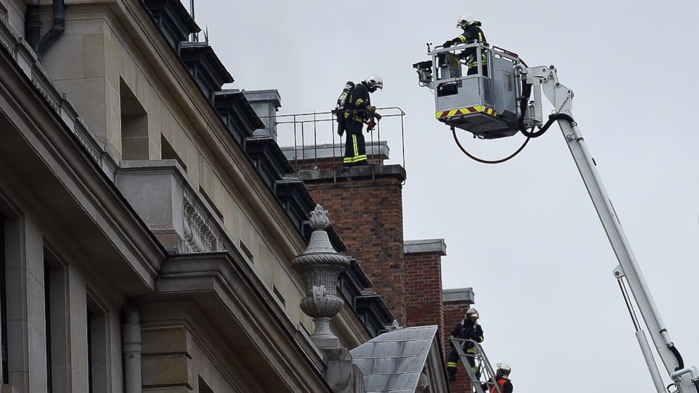 Firefighters work on extinguishing a fire at the Ritz Hotel in Paris on January 19, 2016. The hotel is closed for renovations. 