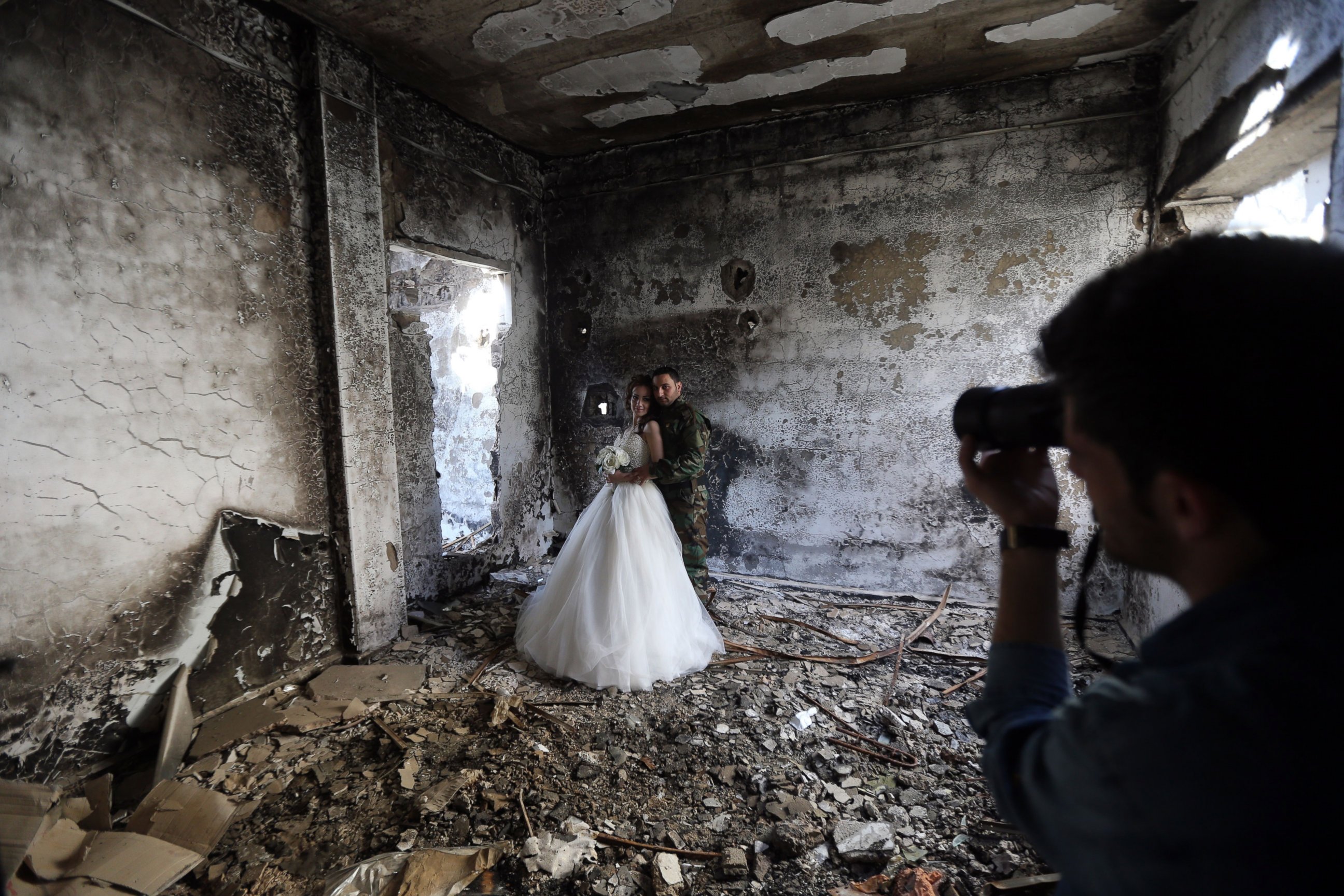 PHOTO: Newly-wed Syrian couple Nada Merhi, and Hassan Youssef, have their wedding pictures taken in a heavily damaged building in the war ravaged city of Homs on Feb. 5, 2016.
