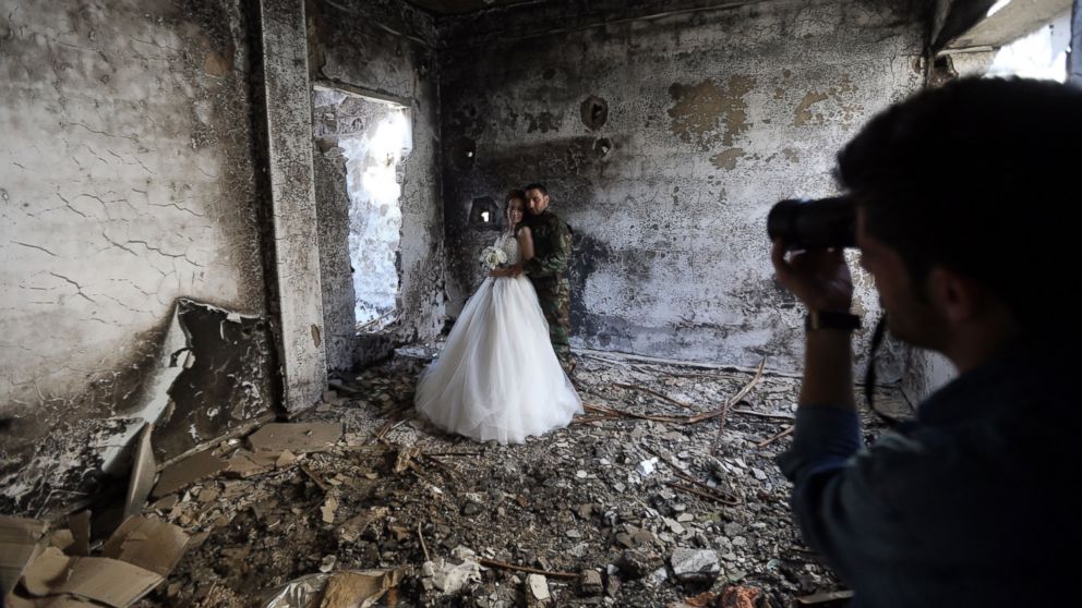 PHOTO: Newly-wed Syrian couple Nada Merhi, and Hassan Youssef, have their wedding pictures taken in a heavily damaged building in the war ravaged city of Homs on Feb. 5, 2016.
