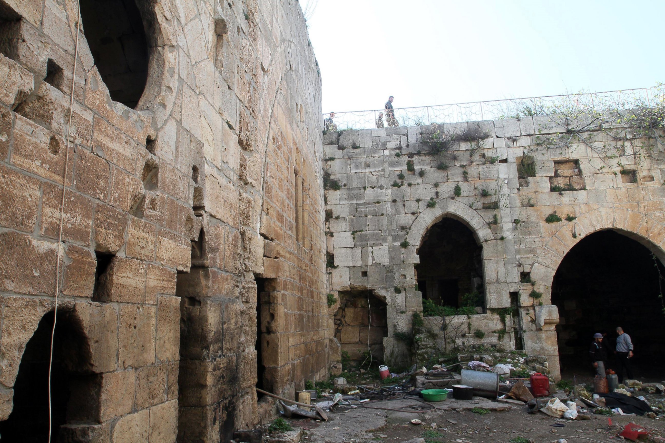 PHOTO:Syrian government forces inspect items left by rebel fighters in the famed Crusader castle, Krak de Chevaliers in the Homs region, March 21, 2014, after they recaptured the castle the previous day.  