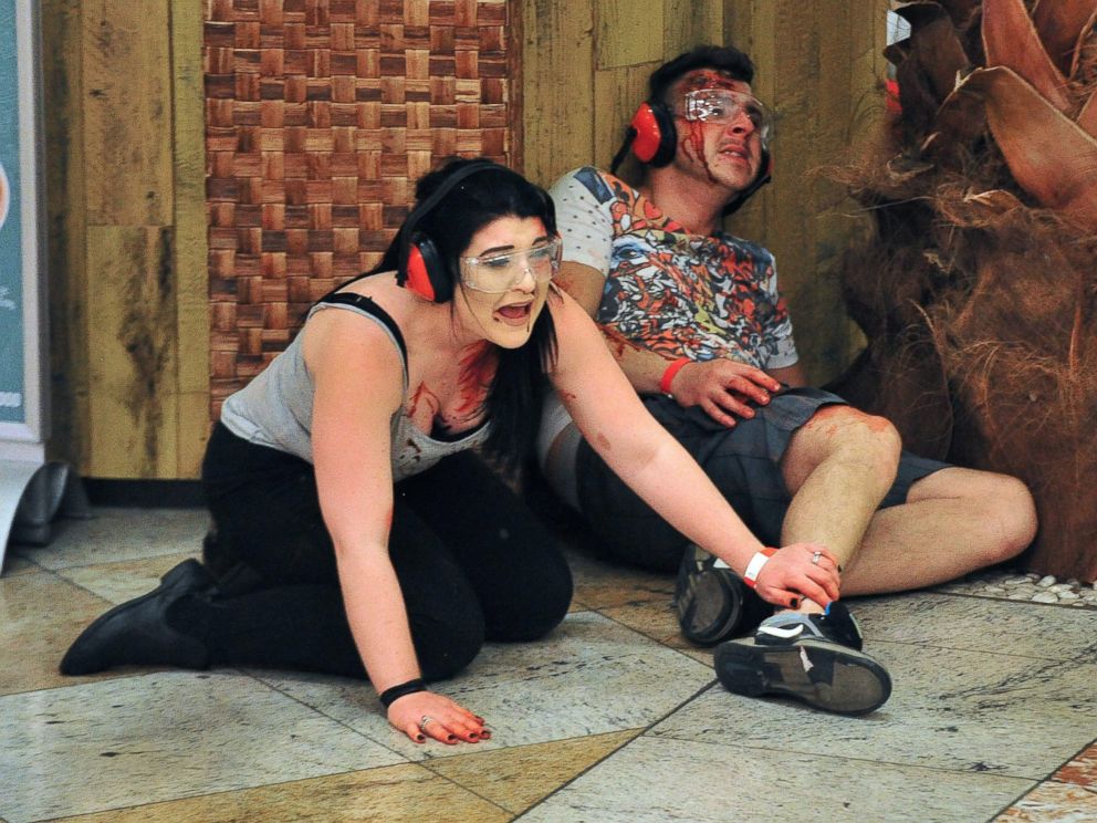 PHOTO: Actors play the parts of casualties during a simulation of an attack by a suicide bomber inside a shopping centre in Manchester, north west England on May 10, 2016. 