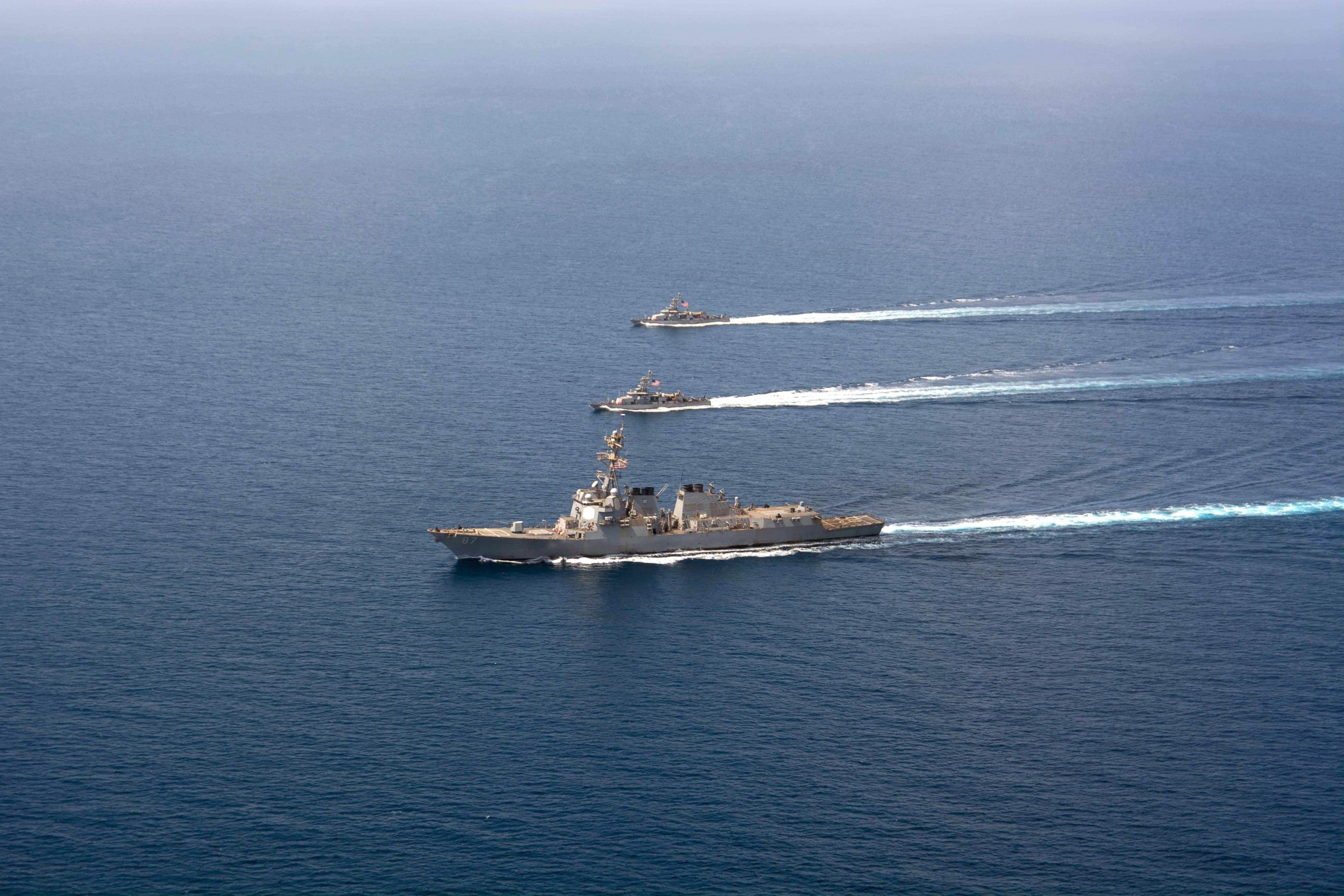 PHOTO: A file image released by the US Navy shows a guided-missile destroyer USS Mason (DDG 87) conducting formation exercises with the Cyclone-class patrol crafts USS Tempest (PC 2) and USS Squall (PC 7), on Sept. 10, 2016.