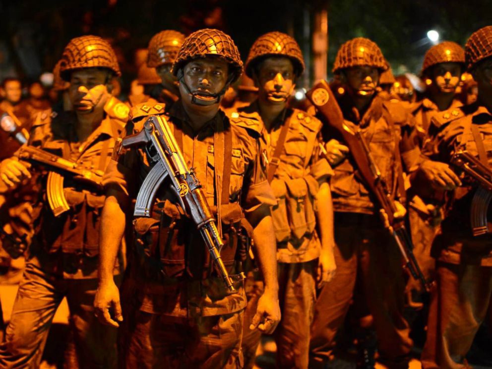 PHOTO: Bangladeshi security officers stand guard near a restaurant that has been attacked by unidentified gunmen in the early hours of July 2, 2016, in Dhaka, Bangladesh.