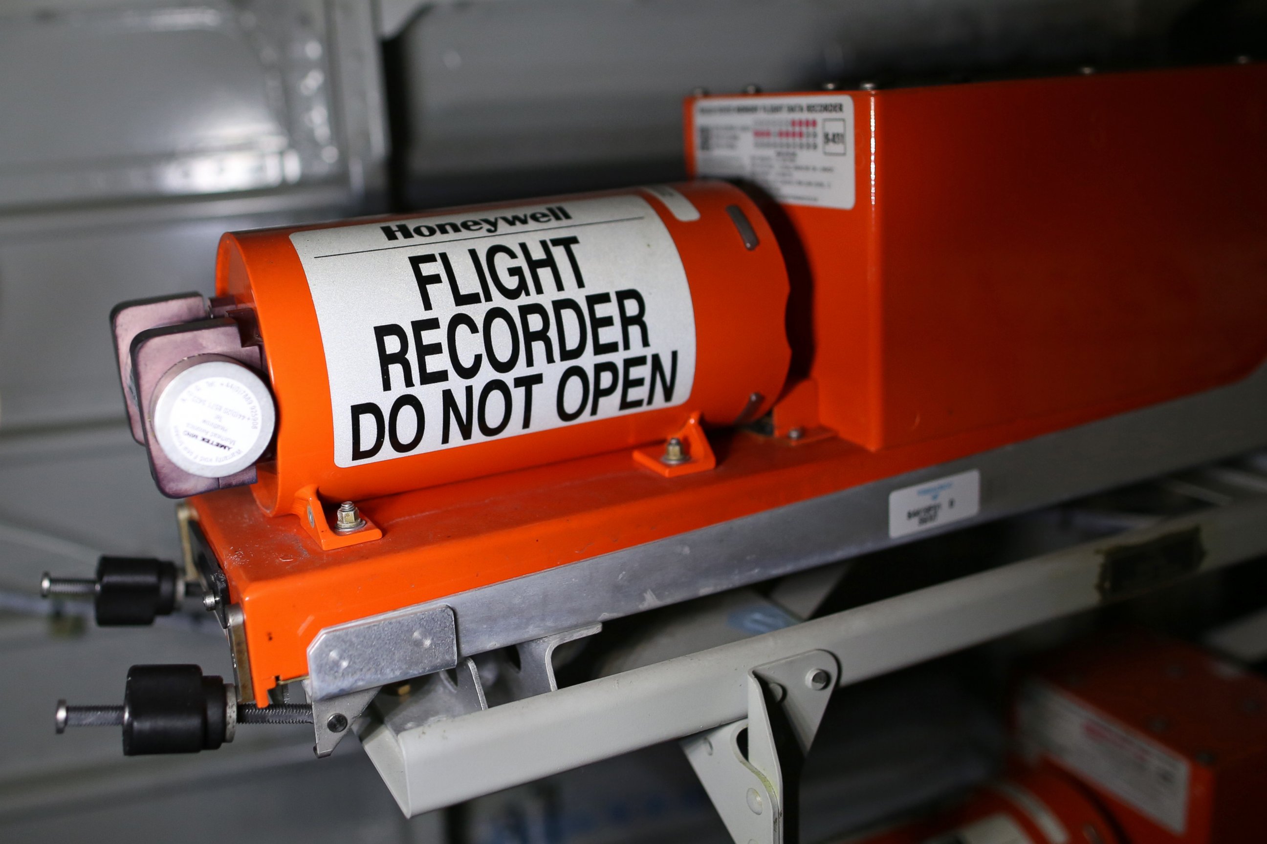 PHOTO: Black boxes, like the one pictured above from a different plane, are painted bright orange but remain difficult for someone to find amid aircraft wreckage unless they have specialty training.
