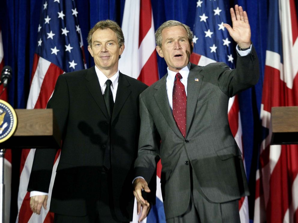 PHOTO: George W. Bush, right, and Tony Blair wave after their joint press conference at Crawford High School 06, April 2002, in Crawford, Texas. The Blairs joined the Bushs at their 1,600 acre Prairie Chapel Ranch for the weekend.