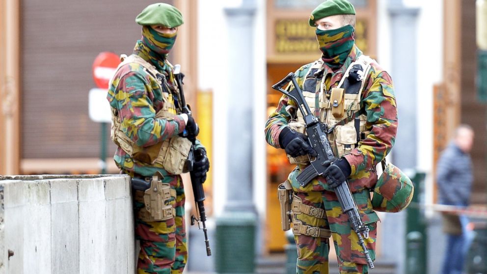 Security forces of Belgium stand guard as two people arrested on suspicion of terrorism in Brussels,  Dec. 29, 2015. 