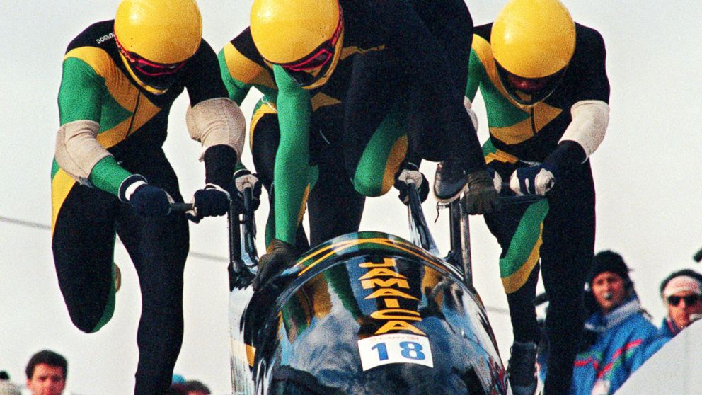 Jamaican four-man bobsleigh pilot Dudley Stokes jumps in as his three teammates push off at the start of the second run of the Olympic four-man bobsleigh event Feb. 27, 1988, in Calgary.