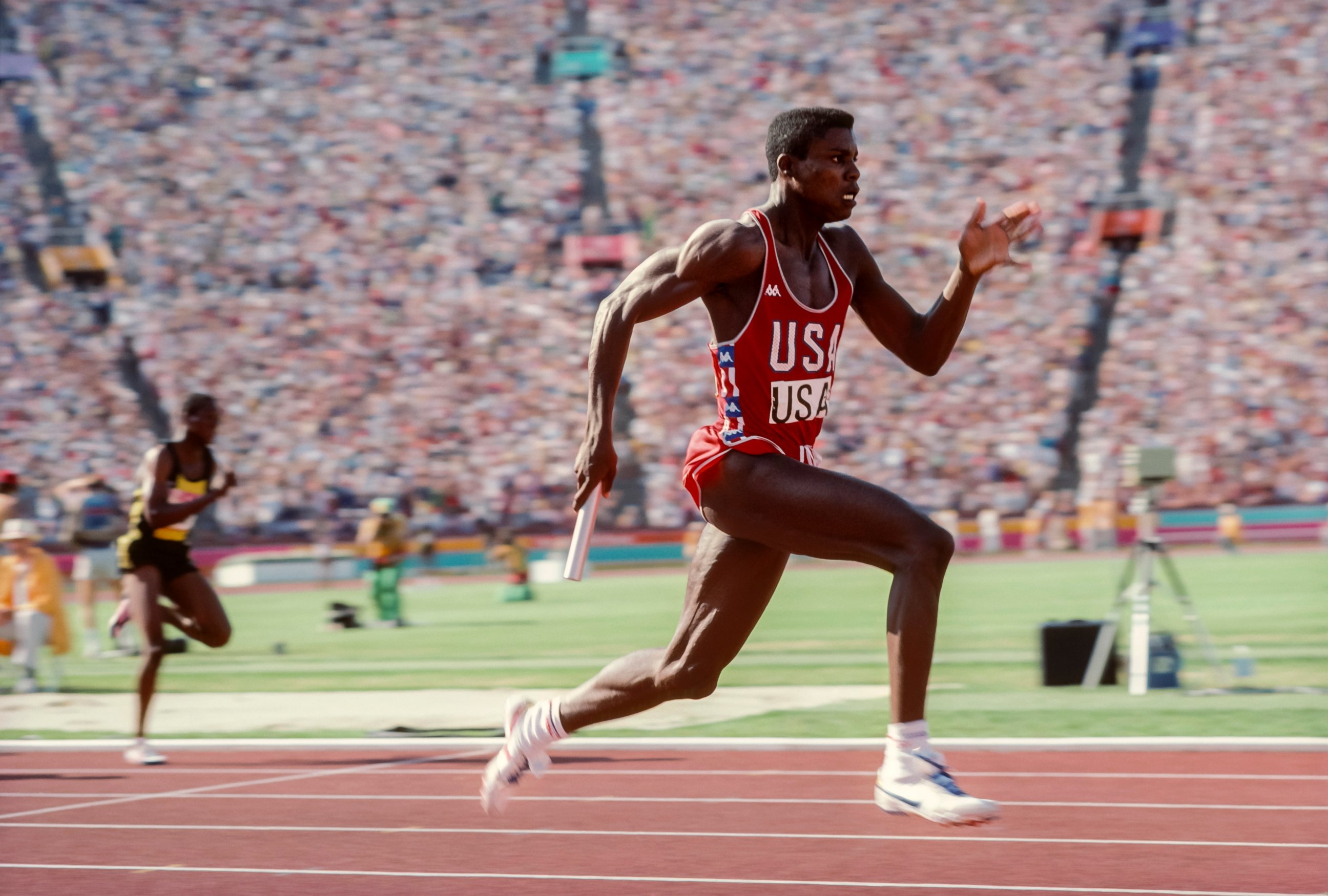 PHOTO: Carl Lewis of the USA runs the anchor leg of the Men's 4x100m relay race of the Track and Field competition at the 1984 Olympic Games held, Aug. 11, 1984, in Los Angeles.