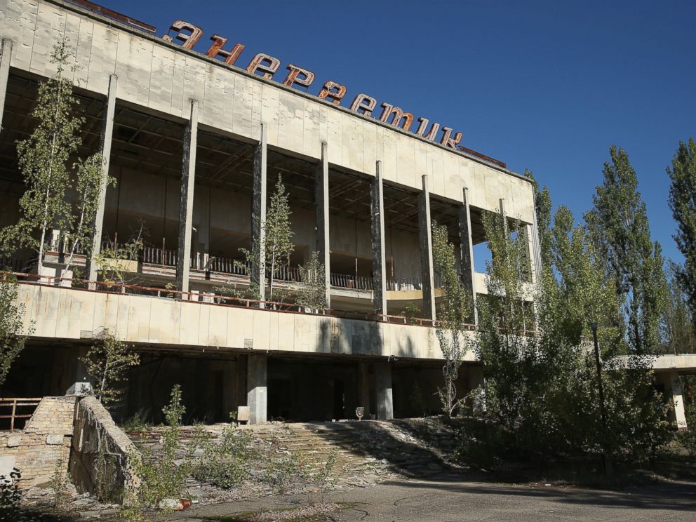 PHOTO: The abandoned Energetik cultural center, that once housed a library, lecture halls and sports facilities, stands on the former main square overgrown with trees, Sept. 30, 2015 in Pripyat, Ukraine.