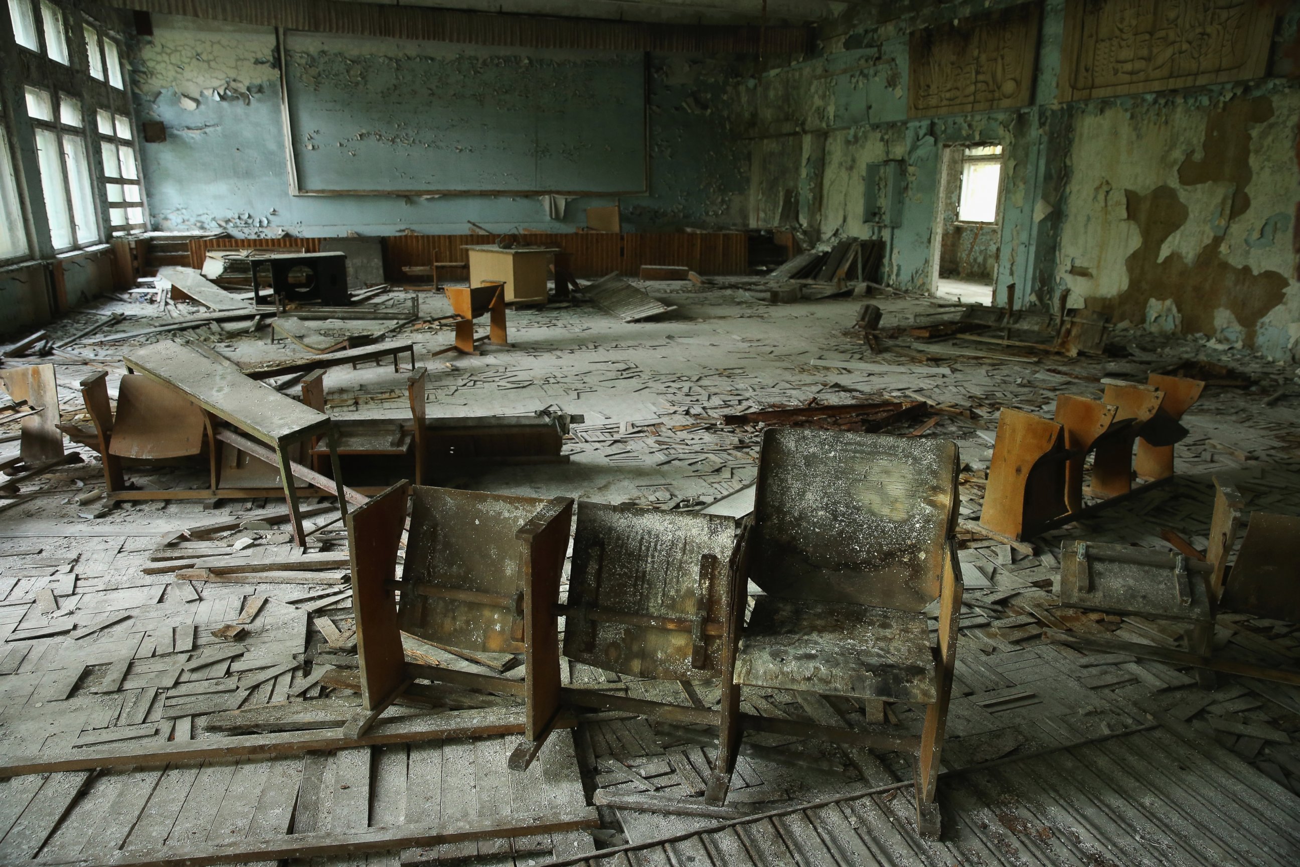 PHOTO: Chairs stand on rotting floorboards in an auditorium of abandoned School Number 3, Sept. 30, 2015, in Pripyat, Ukraine.