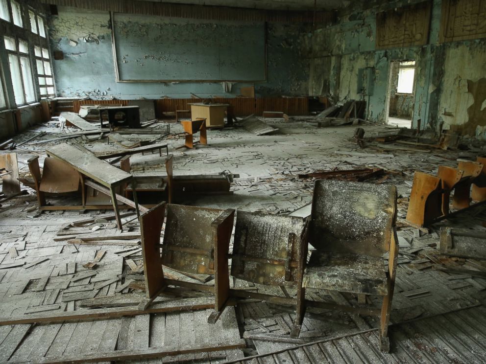 PHOTO: Chairs stand on rotting floorboards in an auditorium of abandoned School Number 3, Sept. 30, 2015, in Pripyat, Ukraine.