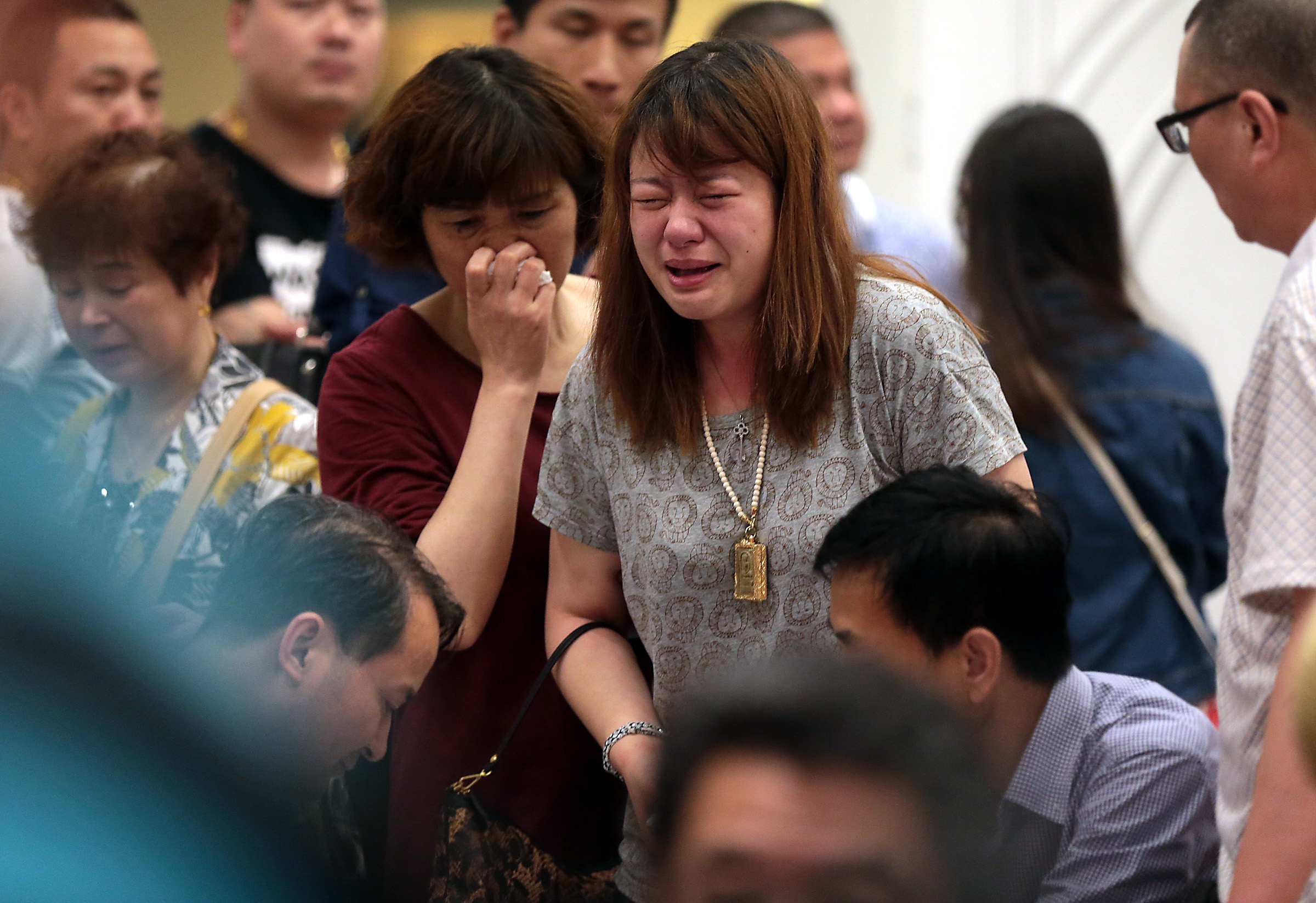 PHOTO: Relatives of passengers of the capsized ship Dongfangzhixing wait for news at the Shijiyuan Hotel on June 2, 2015 in Nanjing, China. 