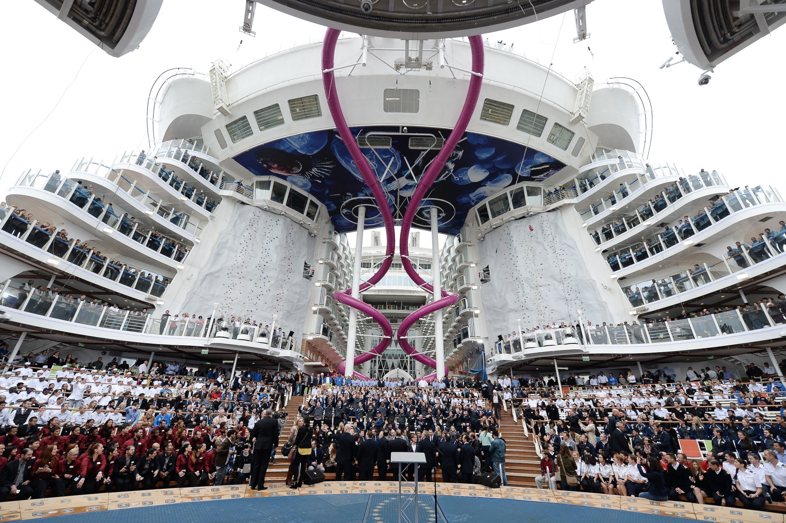 PHOTO: Crew members of the Harmony of the Seas cruise ship are pictured at the STX shipyard of Saint-Nazaire, western France on May 12, 2016 as they attend the delivery ceremony of the boat.