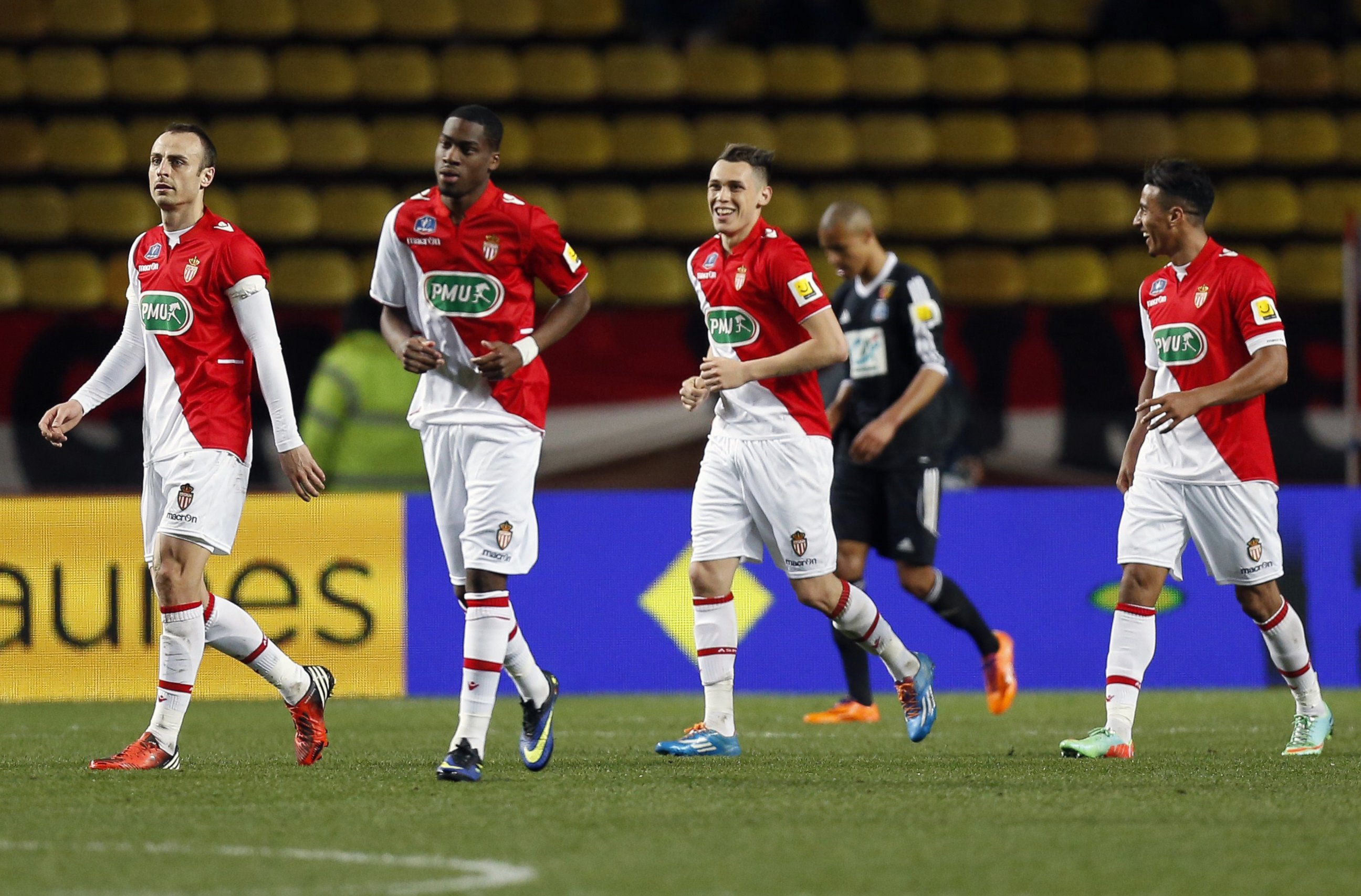 PHOTO: AS Monaco football team members celebrate after scoring during the French Cup football match between AS Monaco and RC Lens, March 26, 2014, at the Louis II  stadium in Monaco.