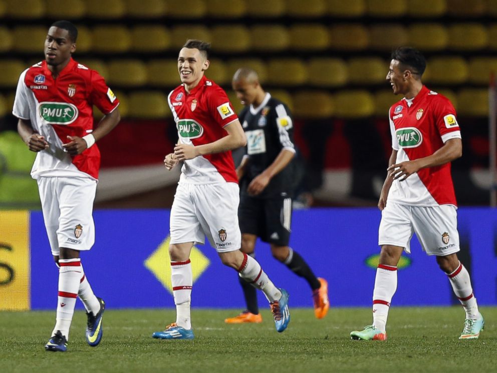 PHOTO: AS Monaco football team members celebrate after scoring during the French Cup football match between AS Monaco and RC Lens, March 26, 2014, at the Louis II stadium in Monaco.