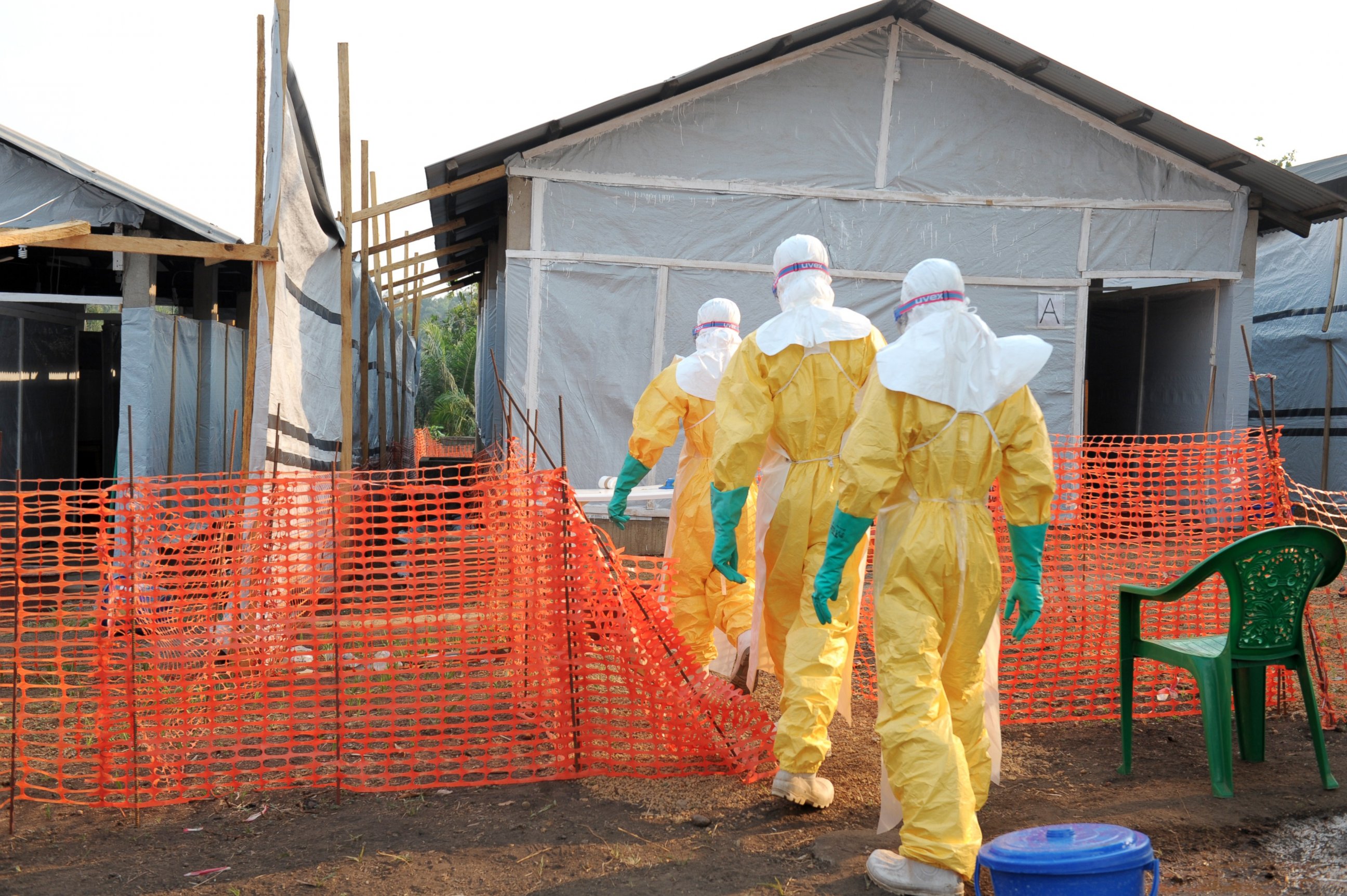 PHOTO: Health specialists work in an isolation ward for patients at the Doctors Without Borders facility in Guekedou, southern Guinea on March 31, 2014. 