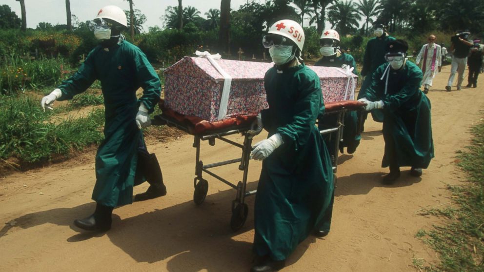PHOTO: Health workers transport the casket of a nun whose death resulted from an Ebola infection on Jan. 1, 1995 in Kikwit, Zaire. 