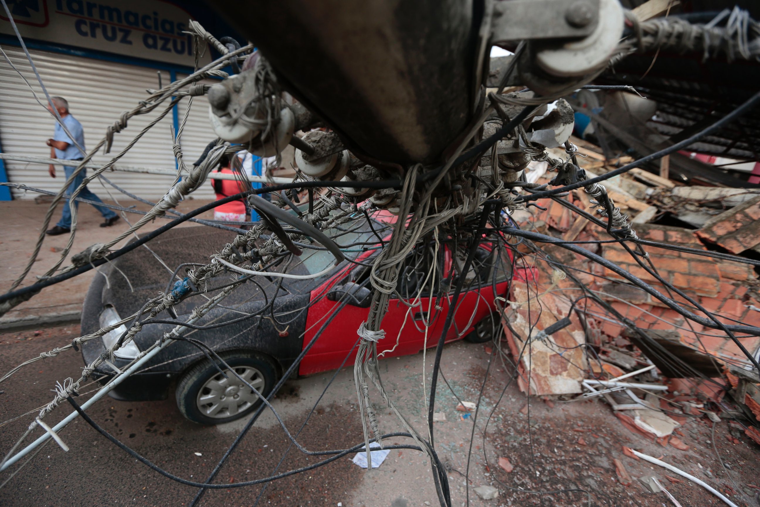 PHOTO: View of a car squashed by rubble after a 7.8-magnitude quake in Portoviejo, Ecuador on April 17, 2016. 