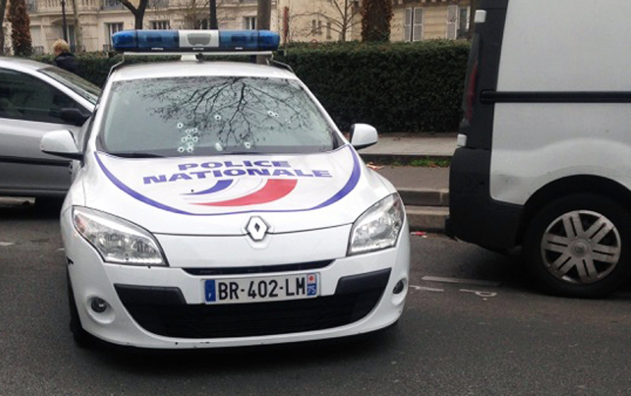 PHOTO: A police car riddled with bullets during an attack on the offices of the newspaper Charlie Hebdo in Paris, Jan. 7, 2015.