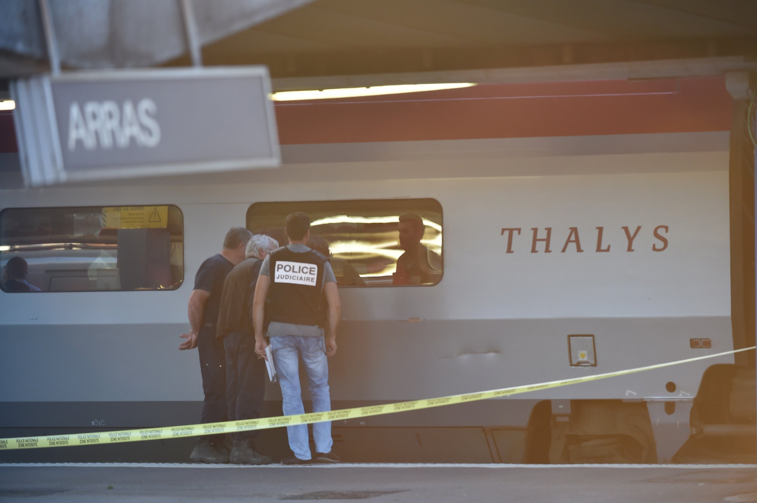 PHOTO: Crime investigators look into the window of a Thalys train of French national railway operator SNCF at the main train station in Arras, northern France, Aug. 21, 2015. 