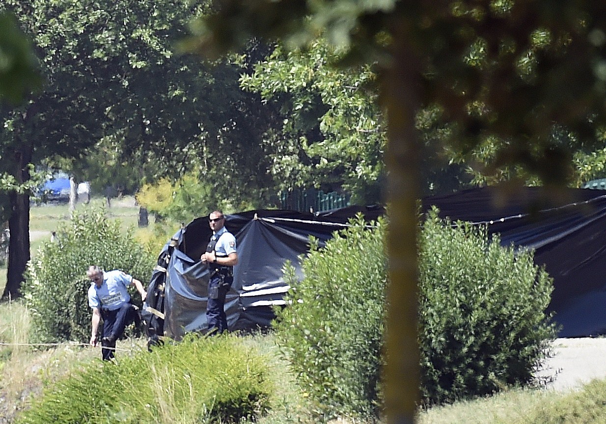 PHOTO: French security stand next to the enclosed area near the Air Products company in Saint-Quentin-Fallavier, near Lyon, central eastern France, June 26, 2015.  