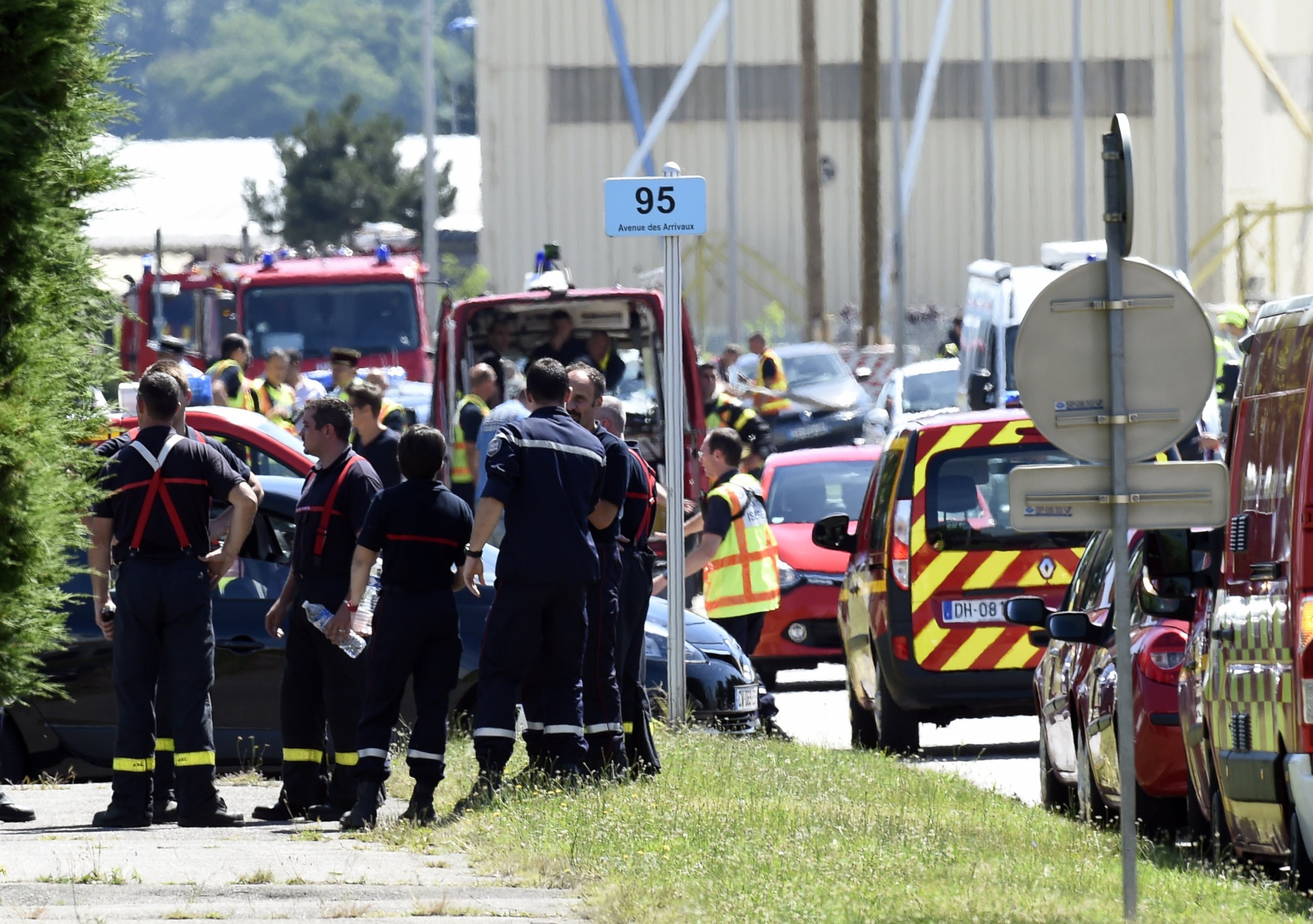 PHOTO: French police and firefighters gather at the entrance of the Air Products company in Saint-Quentin-Fallavier, near Lyon, central eastern France, June 26, 2015.