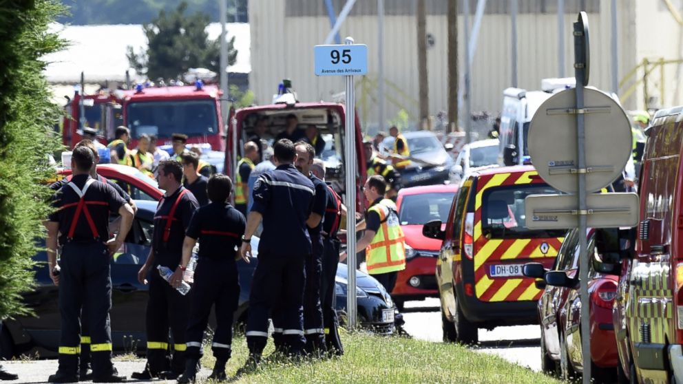 PHOTO: French police and firefighters gather at the entrance of the Air Products company in Saint-Quentin-Fallavier, near Lyon, central eastern France, June 26, 2015.