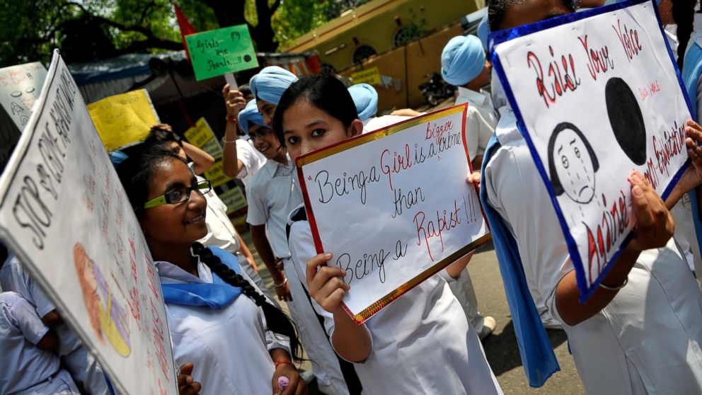 PHOTO: Sikh School children hold placards during a protest against a brutal rape