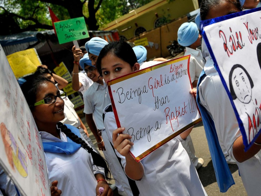 PHOTO: Sikh School children hold placards during a protest against a brutal rape