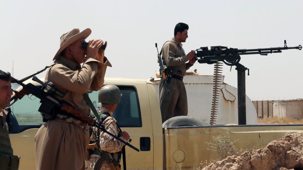 Iraqi Kurdish forces take position as they fight jihadist militants from the Islamic State of Iraq and the Levant (ISIL) on June 29, 2014 in the Iraqi village of Bashir (Basheer), 20 kilometers south of the city of Kirkuk.  