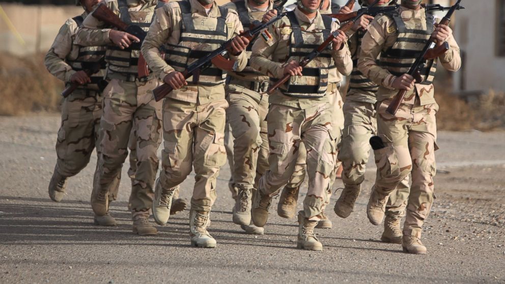 PHOTO: Iraqi soldiers take part in a training session, instructed by American and Iraqi military trainers, at the Taji base complex, located north of Baghdad on Jan. 7, 2015. 