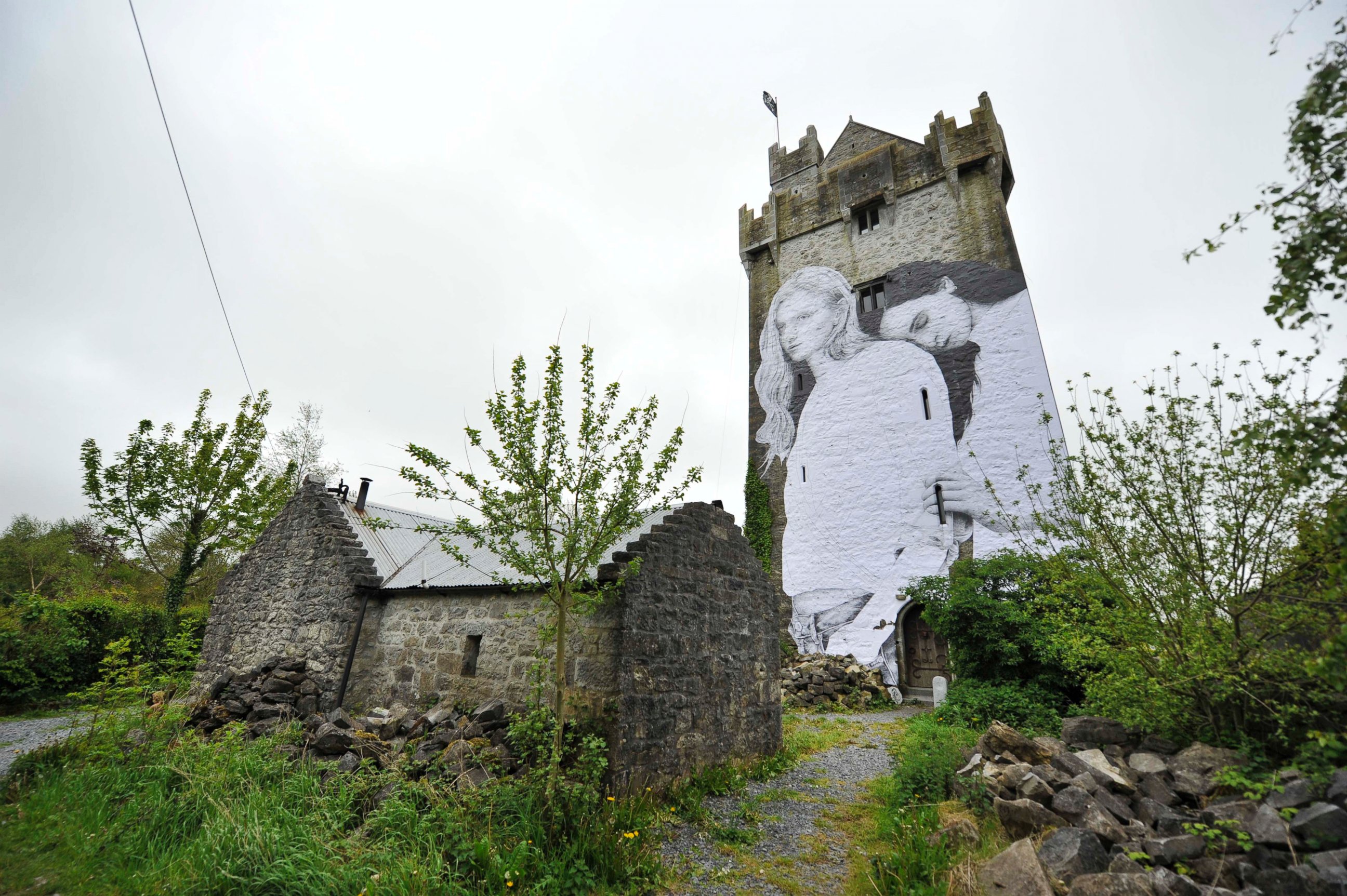 PHOTO: A 50 foot mural created by artist Joe Caslin stands on the side of Caherkinmonwee Castle, promoting the Yes campaign in favor of same-sex marriage, on May 22, 2015 in Galway, Ireland.
