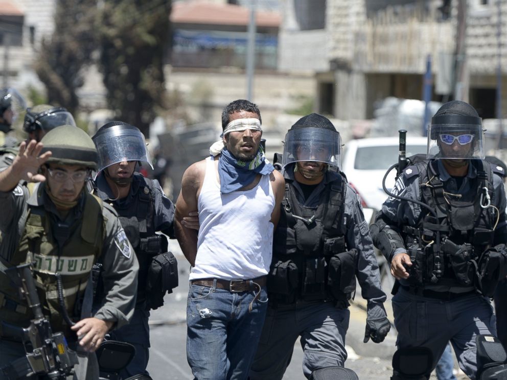 PHOTO: Israeli security forces detain a Palestinian man during a demonstration after Friday prayers