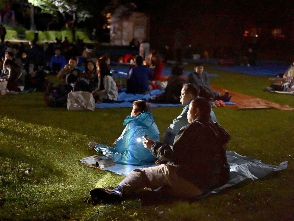 PHOTO: Evacuated residents wait at a park in Higashi-ku in Kumamoto City, Japan, April 16, 2016.