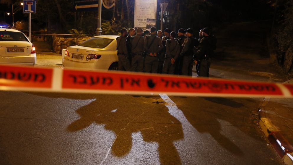 Israeli security forces gather behind a security perimeter outside the Menachem Begin Heritage Center where a Jewish activist was wounded during a shooting on Oct. 29, 2014 in Jerusalem.