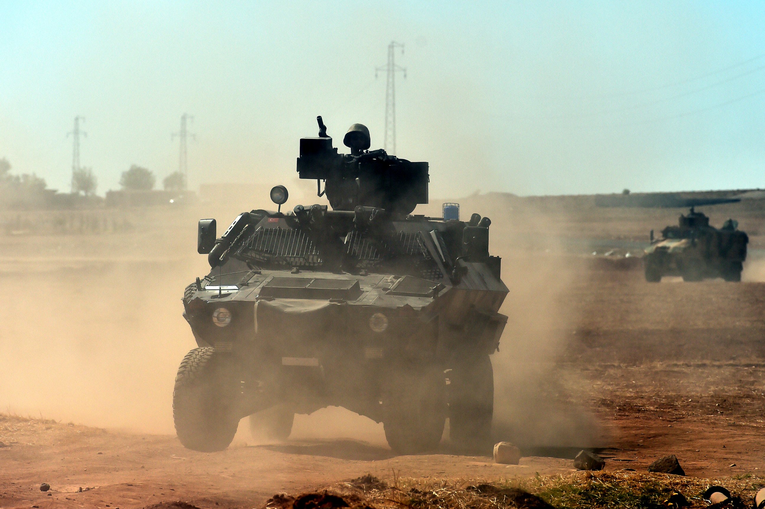 PHOTO: Turkish army patrols near the Turkish-Syrian border area near the Syrian town of Ain al-Arab, known as Kobani by the Kurds, in the southeastern town of Suruc, Turkey, Oct. 7, 2014.