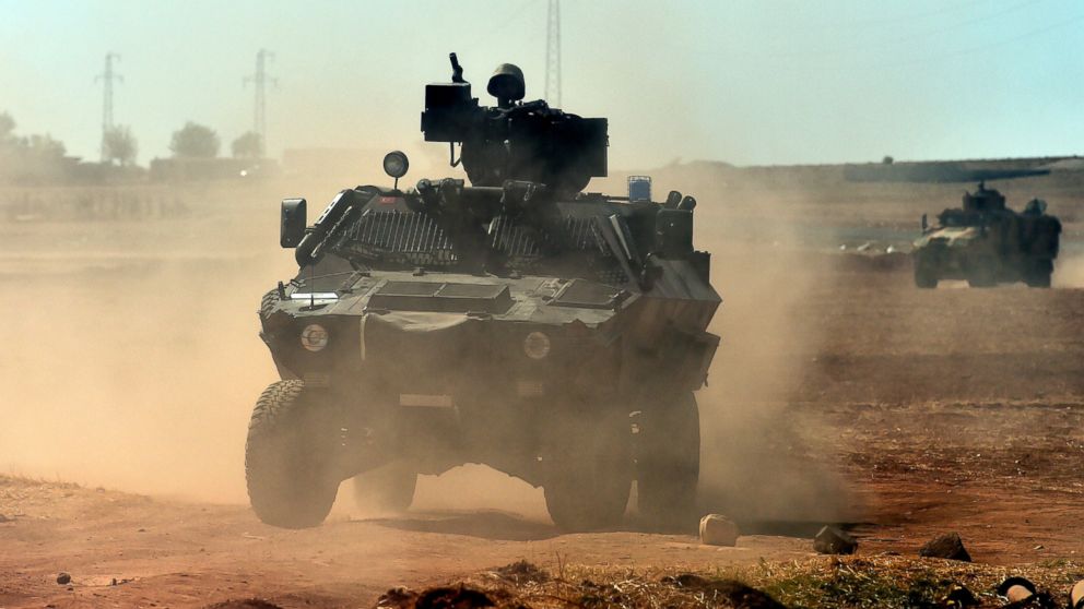 PHOTO: Turkish army patrols near the Turkish-Syrian border area near the Syrian town of Ain al-Arab, known as Kobani by the Kurds, in the southeastern town of Suruc, Turkey, Oct. 7, 2014.