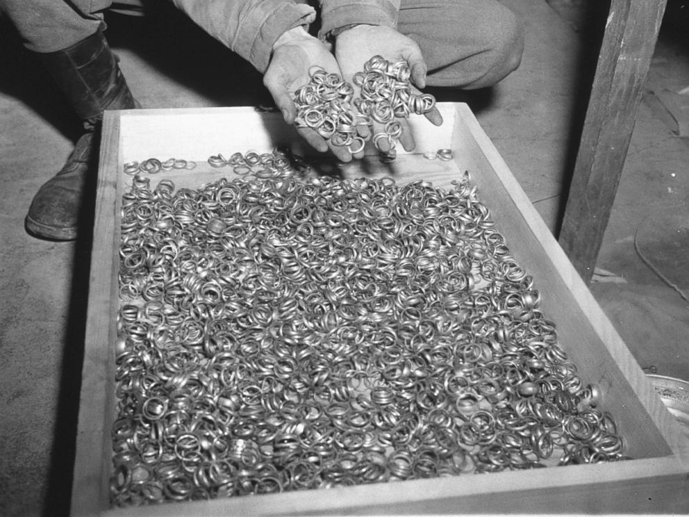 PHOTO: A U.S. soldier inspects thousands of gold wedding bands taken from Jews by the Nazis and stashed in the Heilbron Salt Mines, May 3, 1945 in Germany. The treasures were uncovered by allied forces after the defeat of Nazi Germany.