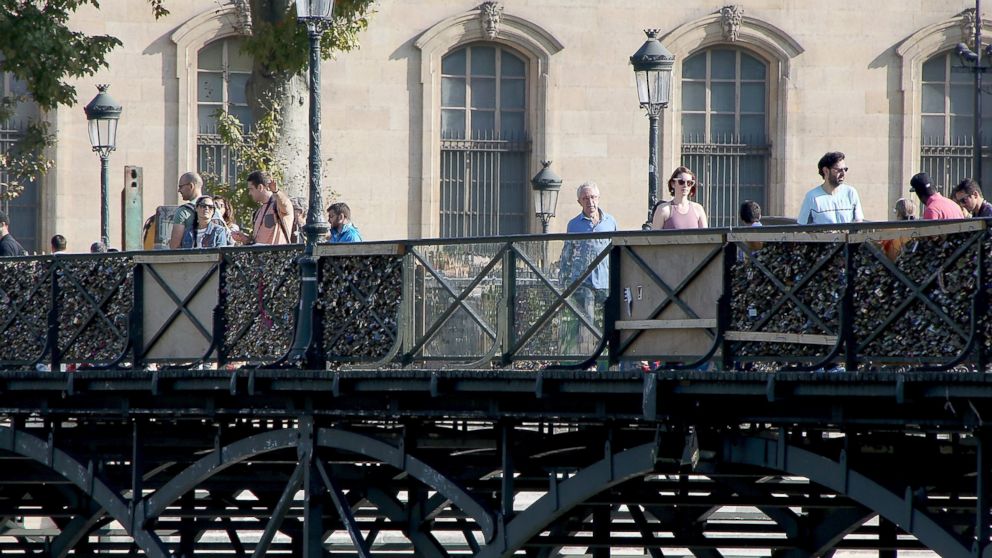 Officials from Paris City Hall have placed plastic panels in order to prevent tourists from attaching love padlocks on the Pont Des Art bridge, Sept. 21, 2014, in Paris.