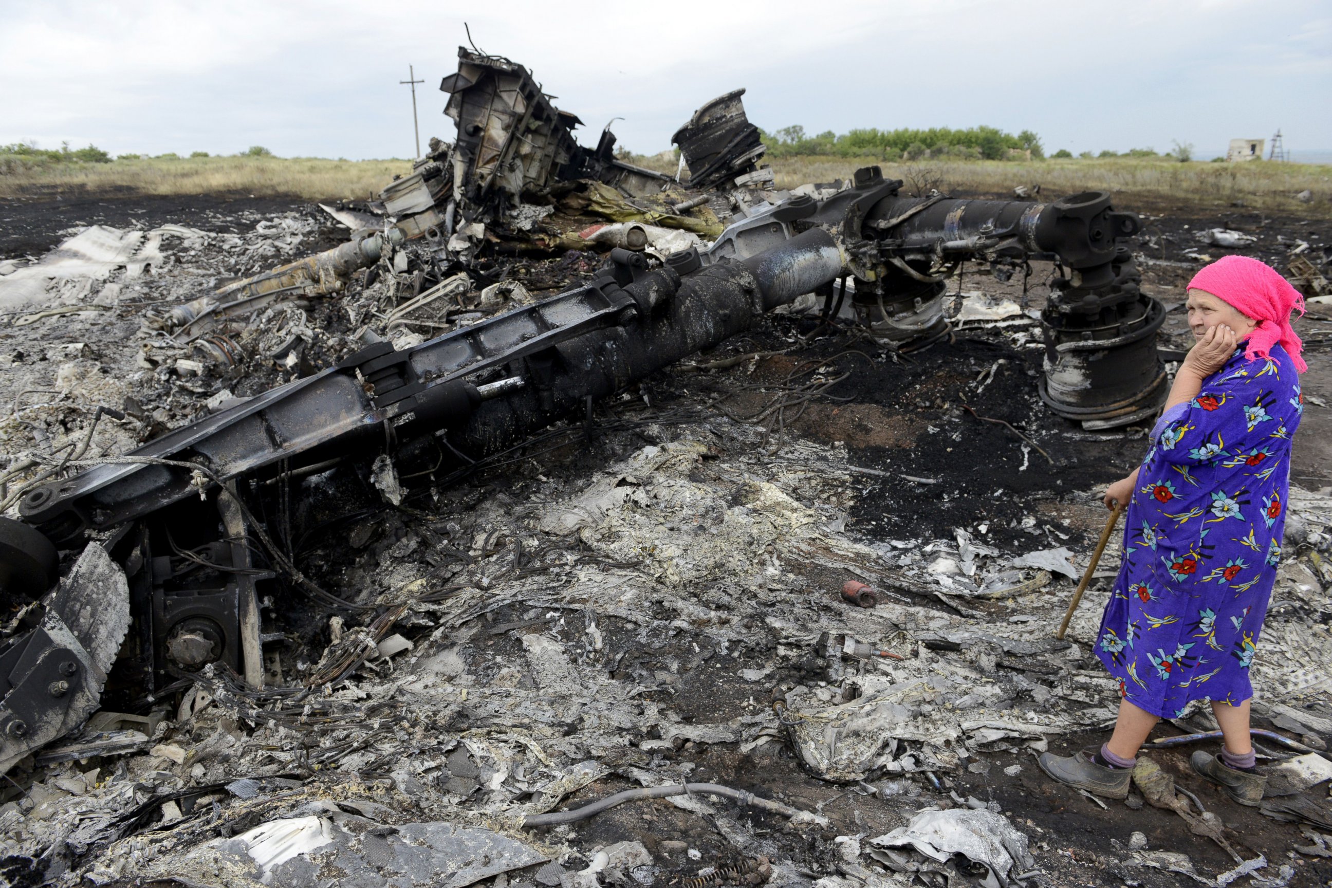 PHOTO: A local resident stands among the wreckage at the site of the crash of a Malaysia Airlines plane carrying 298 people from Amsterdam to Kuala Lumpur in Grabove, in rebel-held east Ukraine, on July 19, 2014.